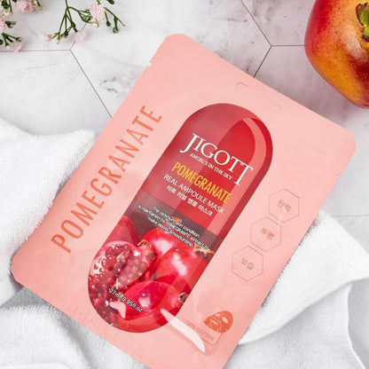 Masca servetel JIGOTT Pomegranate Real Ampoule Mask, cu extract de rodie si fructe, pentru hidratare intensa si luminozitate.