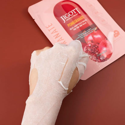 Masca servetel JIGOTT Pomegranate Real Ampoule Mask, cu extract de rodie si fructe, pentru hidratare intensa si luminozitate.